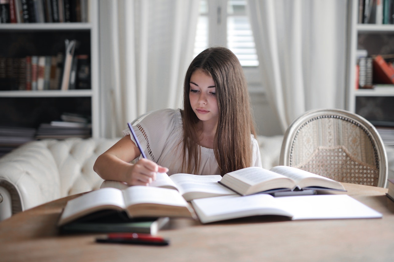 Girl study English on a desk Chatsifieds Learn English faster