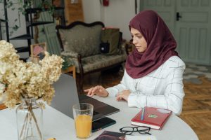 muslim girl study english on desk with a laptop chatsifieds learn english faster
