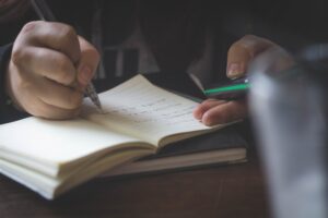 Man taking English note for his english class Chatsifieds Study Differently Learn English faster