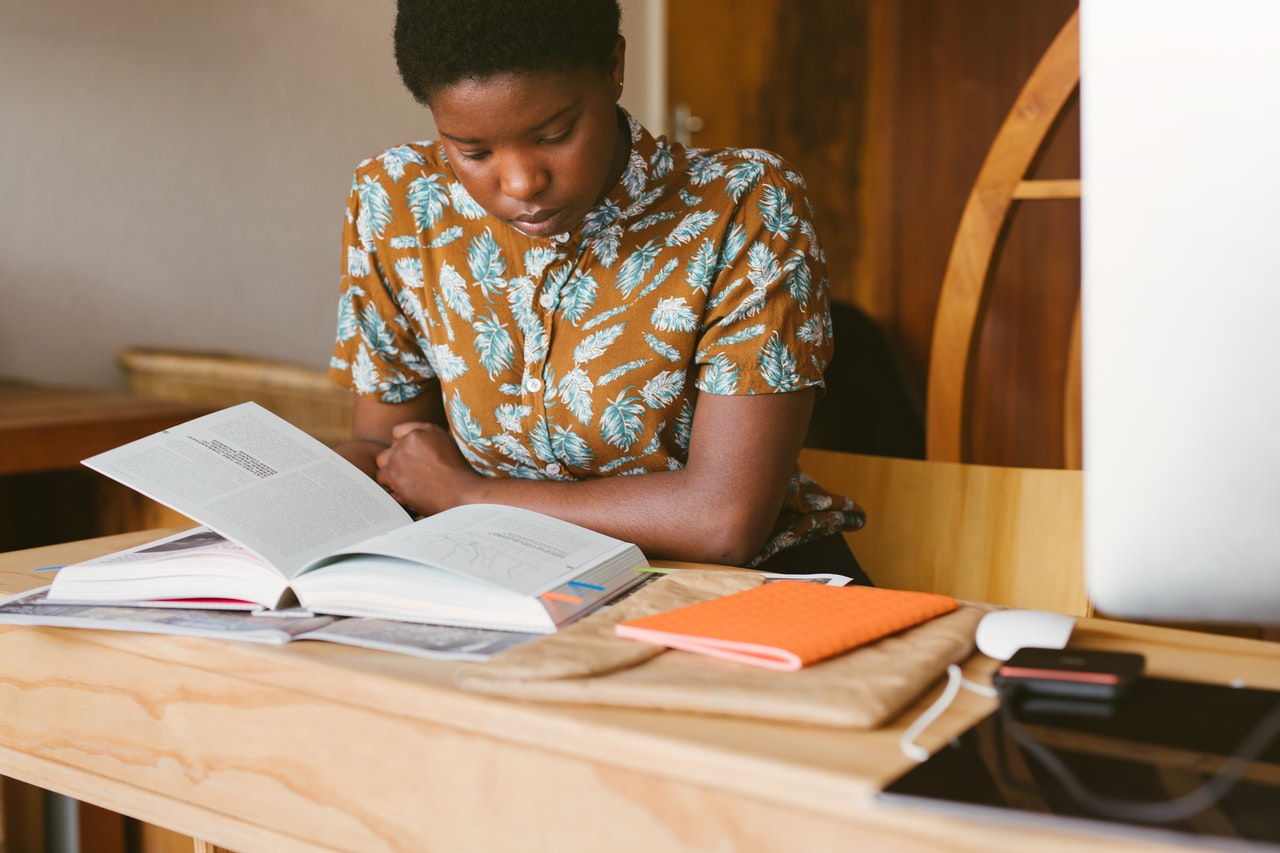 young african female student taking her chatsifieds english grammar test