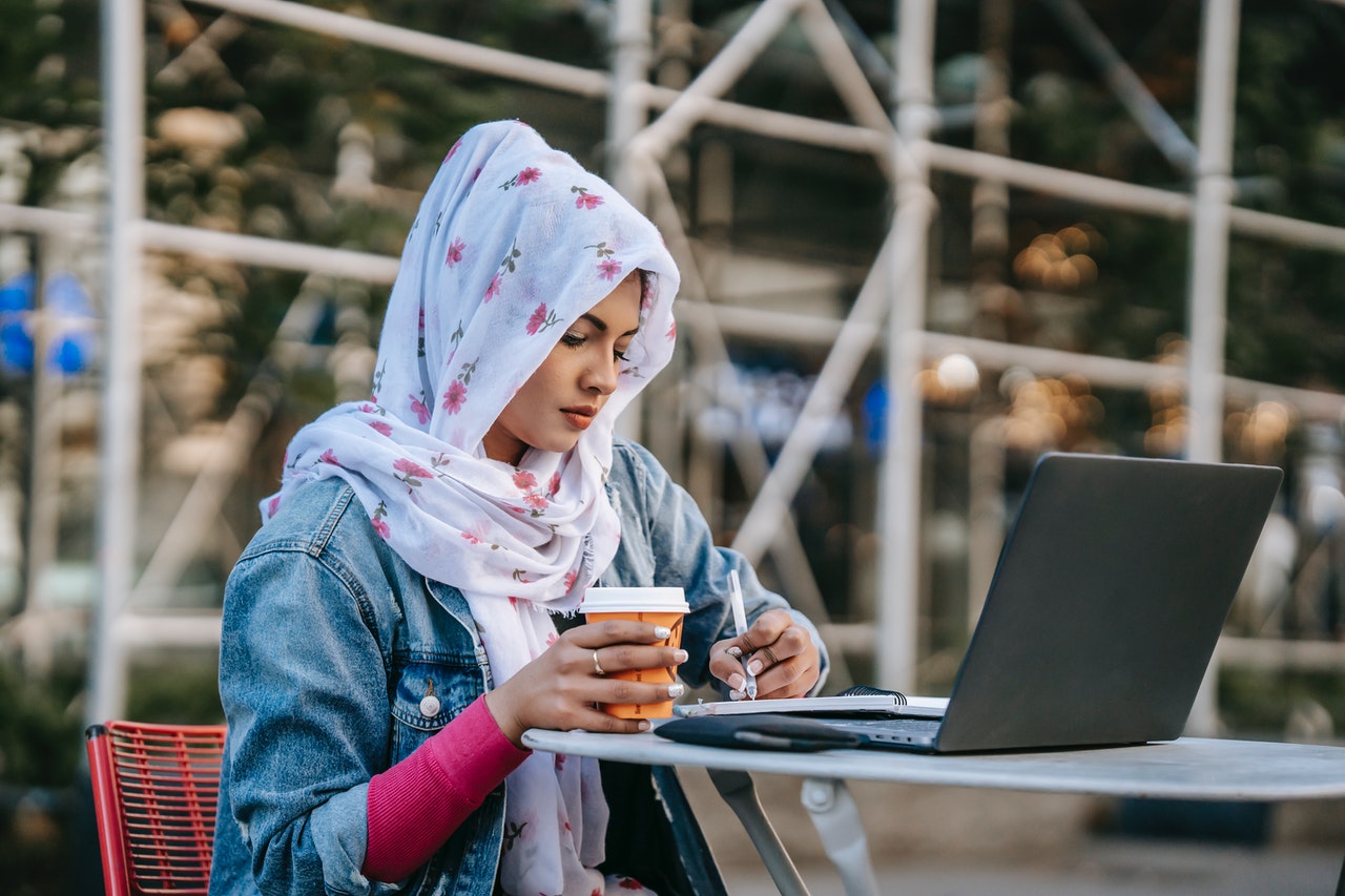 A muslim girl studying her chatsifieds english exam